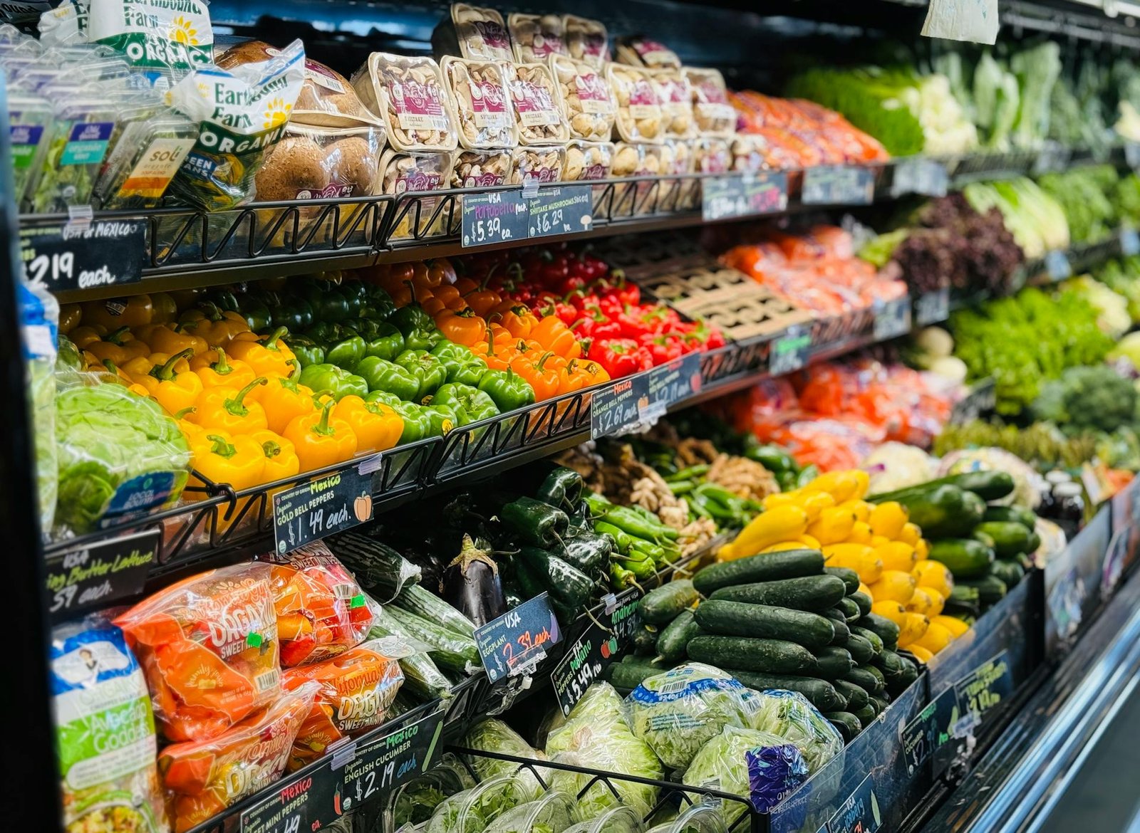 Groceries & Markets - Fresh fruit and vegetables displayed on shelves in a grocery store