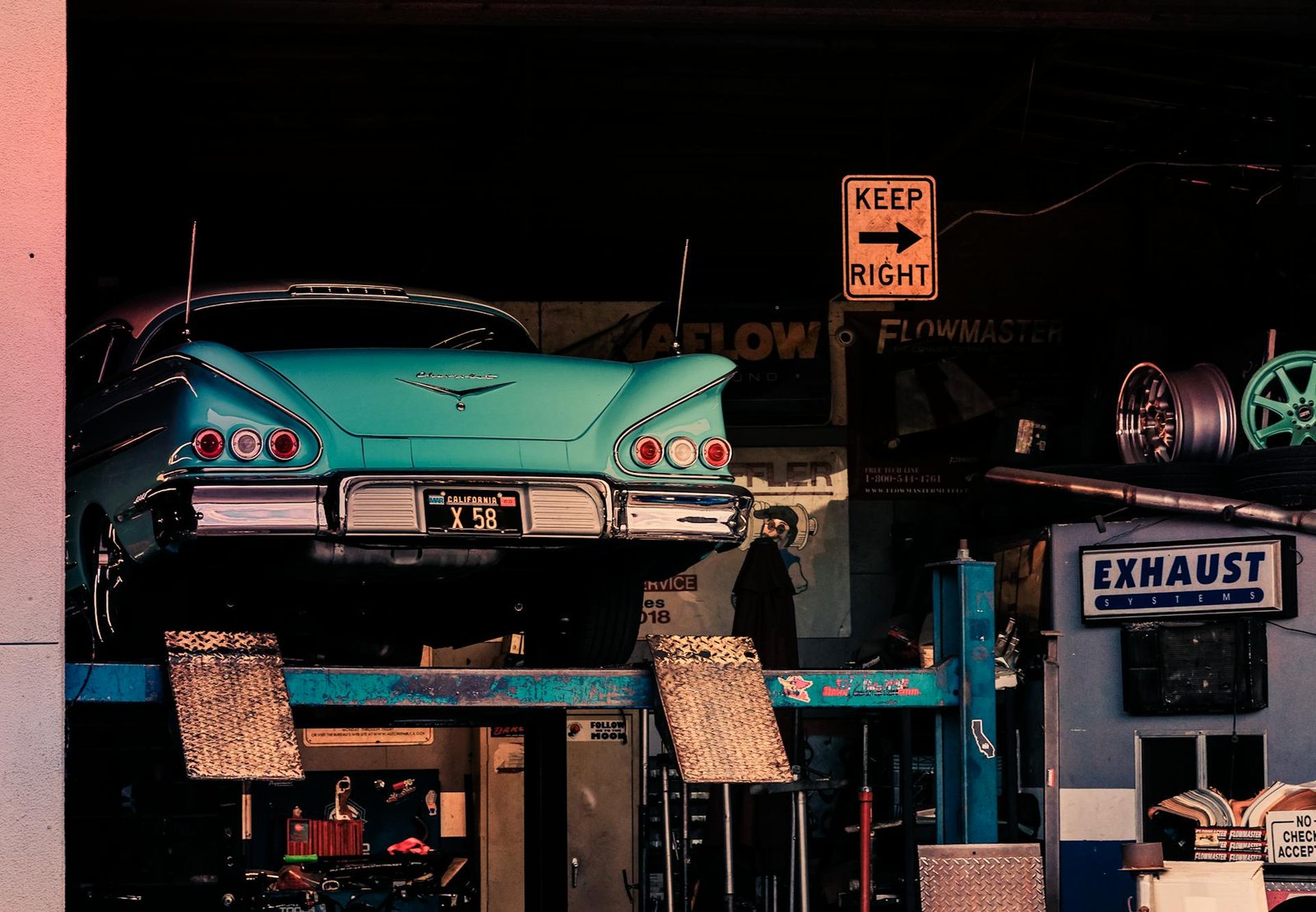 Services - Vintage car up on jacks on the auto shop