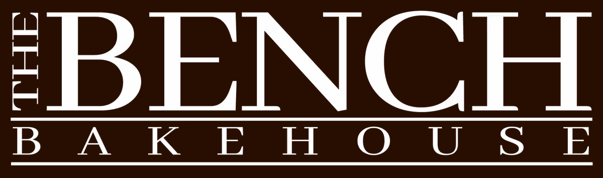 The Bench Bakehouse Logo White on Dark Brown